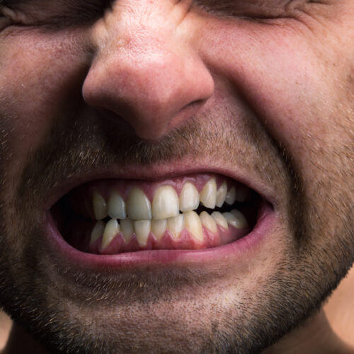Closeup of mouth of very stressed man
