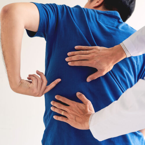 Physiotherapist,Working,Concept,,Doctor,And,Patient,Suffering,Or,Chiropractor,Examining Physiotherapist working concept, Doctor and patient suffering or Chiropractor examining from back pain in clinic medical office